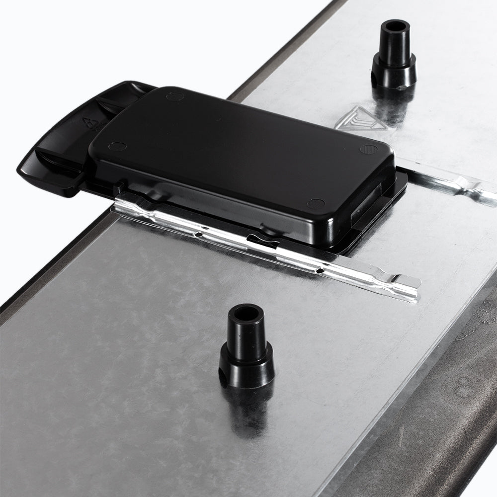 Onderkant van een elektrische bakplaat met verwijderbare vetopvanglade