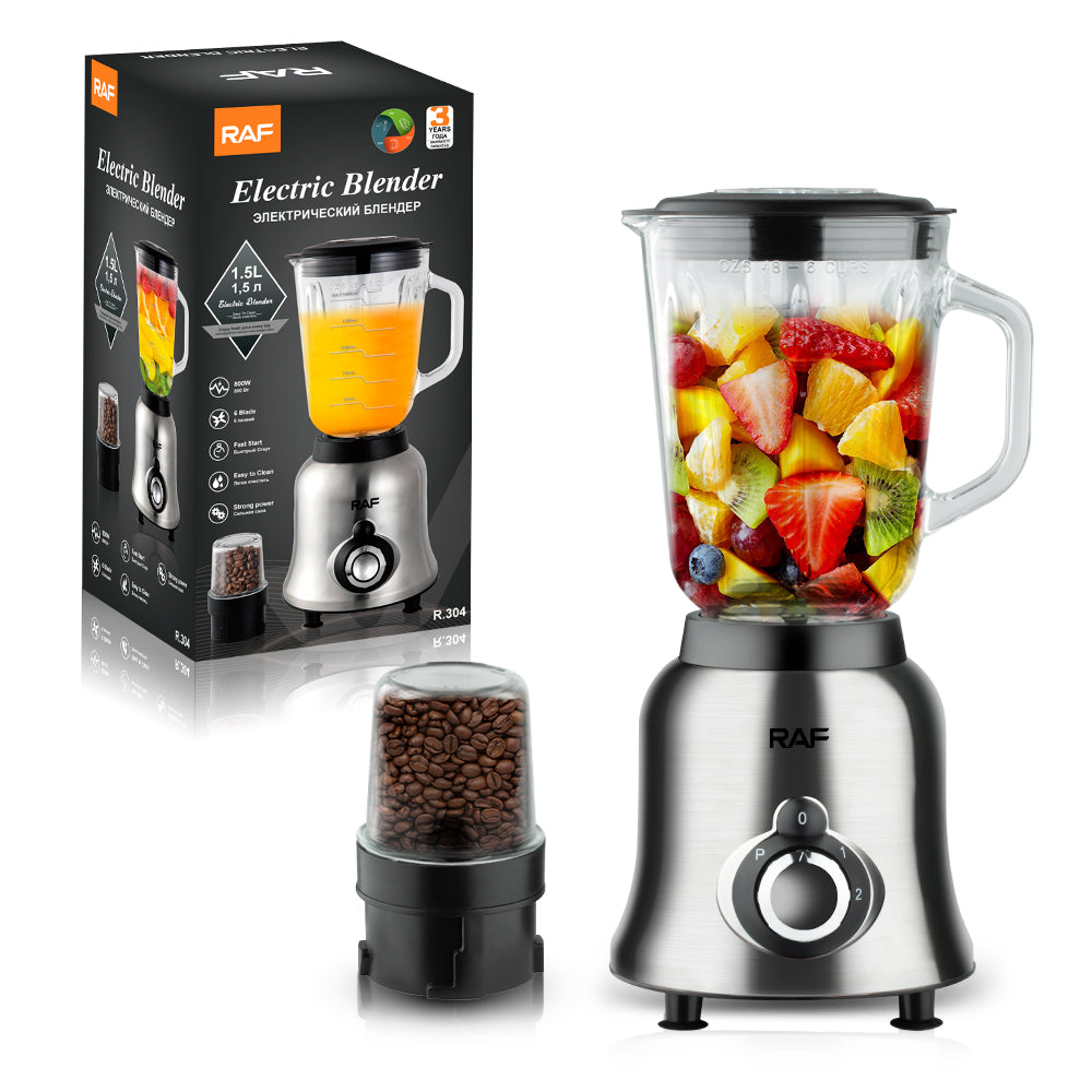 RAF Elektrische Blender met 800W motor, glazen kan gevuld met vers fruit, inclusief een extra koffiemolen en de productverpakking op de achtergrond